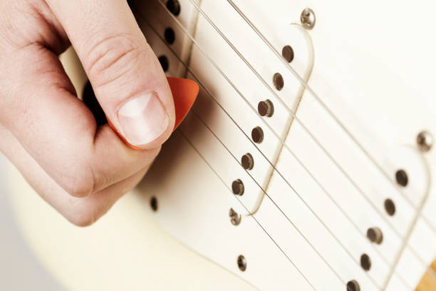 Using plectrum on a vintage electric guitar
