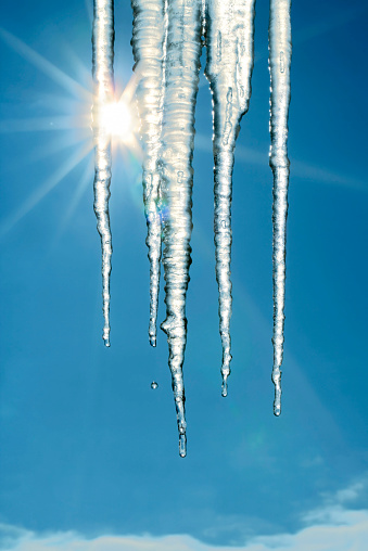 Close-up of icicles melting under the spring sun.