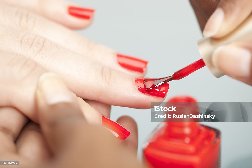 Nail polish. Woman getting manicure. Nail Polish Stock Photo