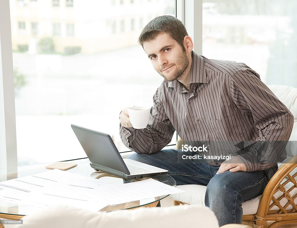 Businessman having a break Businessman having a break with a cup of coffee Adult Stock Photo