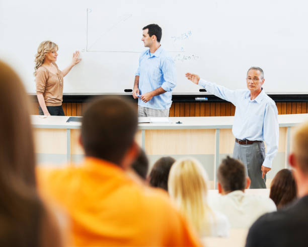 istock Professors and assistants giving a lecture 171352342