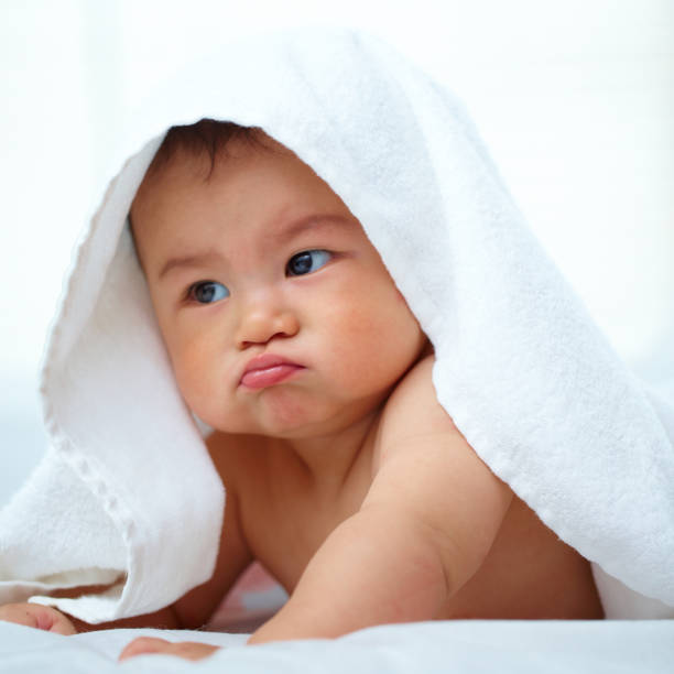 istock lovely baby boy in bed 171352439