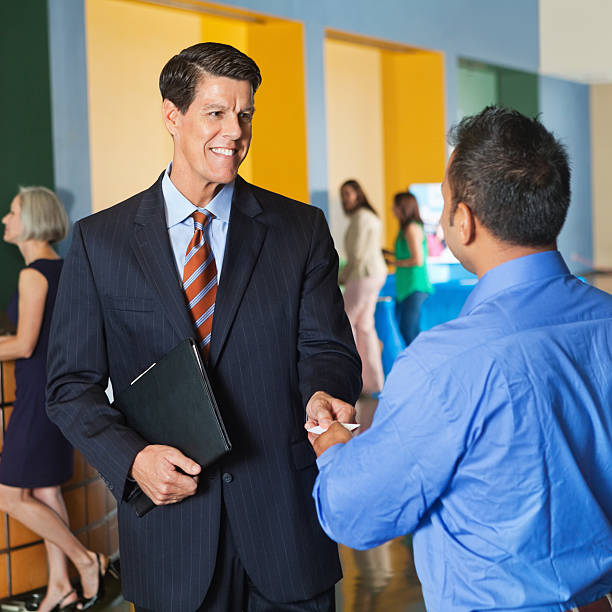 istock Men in corporate attire shaking hands 171352755