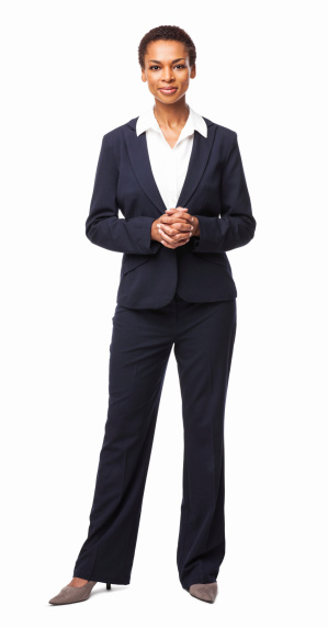 Full length portrait of a confident African American female executive. Vertical shot. Isolated on white.