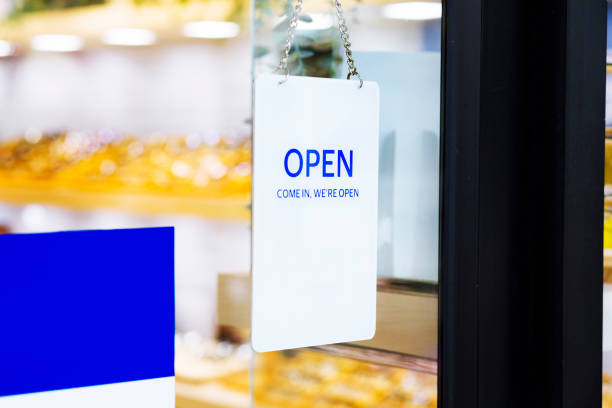 istock Blue white open sign at glassy door 1713530832