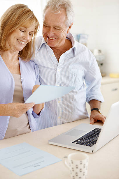 istock Using the laptop to organise their finances 171353085