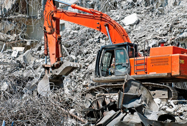 istock Crane separating concrete from metal with shovel attachment 171353129