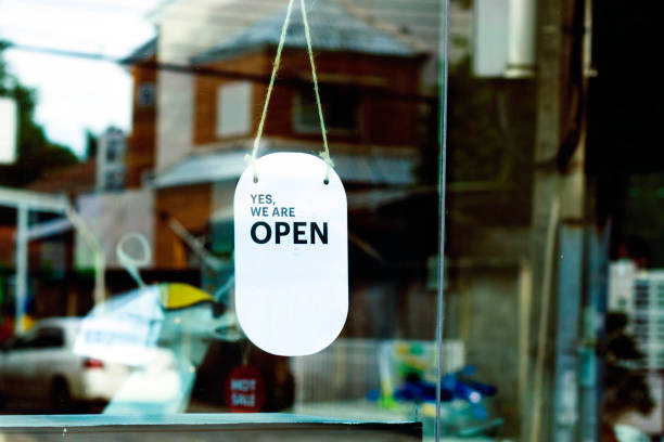 istock Hanging open sign in shop window 1713531888