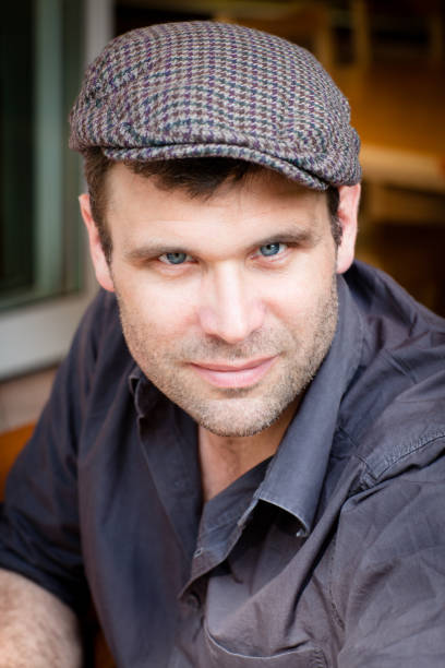 istock portrait from a handsome mature man with flat cap 171353287
