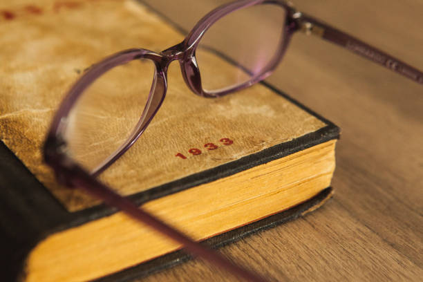istock An old book and glasses on the table 1713533574