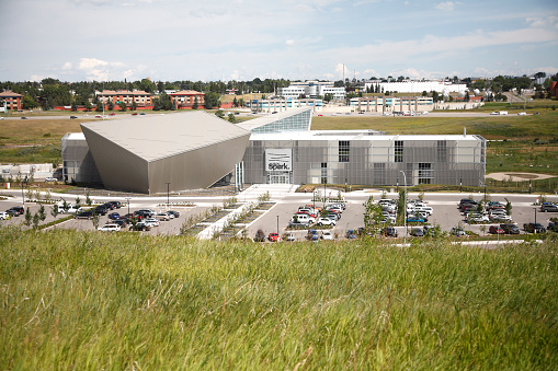 empty parking lot in front of large gray industrial building. large industrial warehouse. parking large warehouse. New modern and large warehouse building