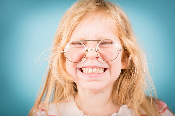 istock Little Girl Making Silly Face While Wearing Vintage Nerdy Glasses 171353665