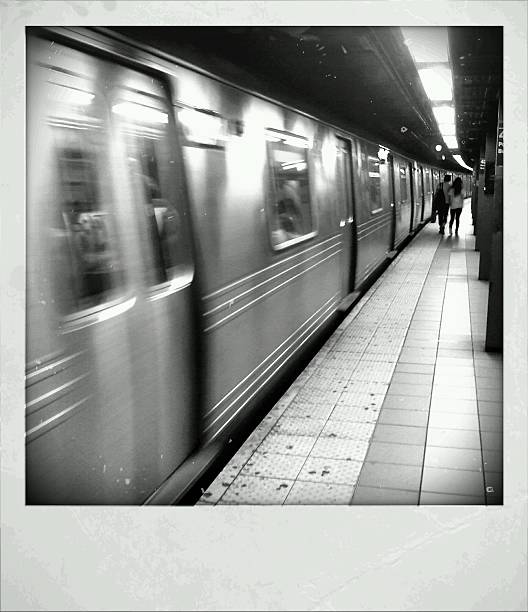 istock NYC Subway Train Leaves Station in Motion Blur 171353786