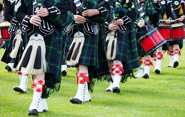 Pipes and Drums Pipers and Drummers in a Marching Band at a Highland Games event in ScotlandSee also my lightbox sporran stock pictures, royalty-free photos & images