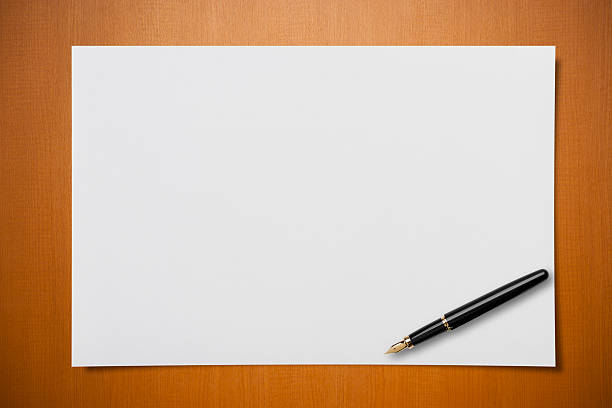 Blank paper on Desk with a pen Blank paper on Desk with a pen. fountain pen pattern writing instrument pen stock pictures, royalty-free photos & images