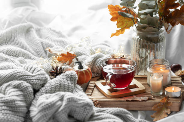 istock Autumn composition with a cup of tea, leaves and a knitted element. 1713550195