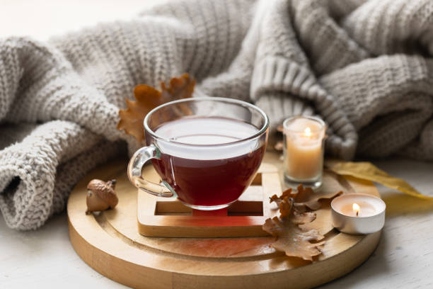 istock Autumn composition with a cup of tea, leaves and a knitted element. 1713550204