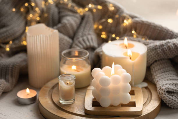 istock A cozy composition with candles, a knitted element and a garland. 1713550205