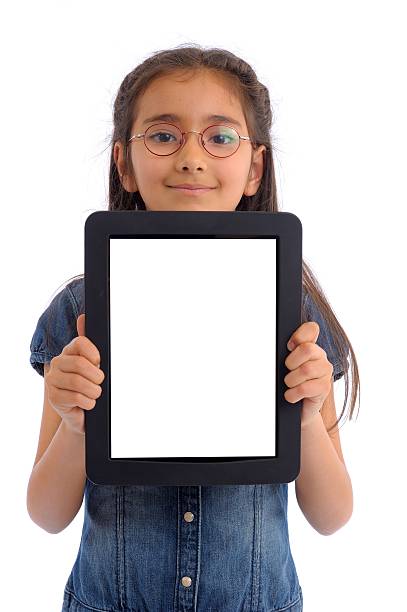 Shot of a little kid using a digital tablet with tablet computer on green background with copy space.