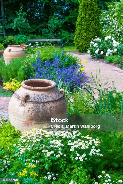Flower Garden With Clay Pots Herbs And Wildflowers Stock Photo - Download Image Now - Rose - Flower, Vegetable Garden, Vertical