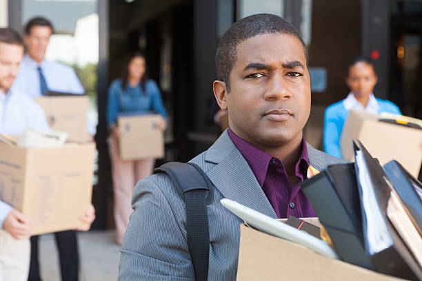 istock Angry employees leaving office building after being fired/ laid off 171355778