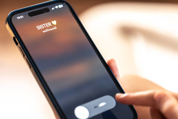 istock Smartphone in child hands with Incoming sister call on a screen. 1713558516