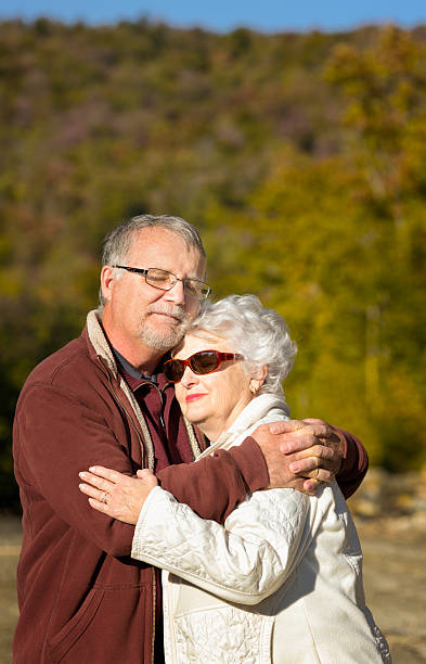 istock Senior couple embracing during a fall promenade 171355913