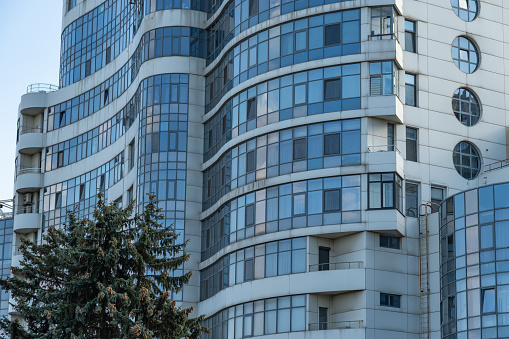 Geometry modern of apartment building exterior. Architectural details of luxury house and home complex. Fragment contemporary residential condominium. New multistorey skyscrapers in business district Dnipro, Ukraine.