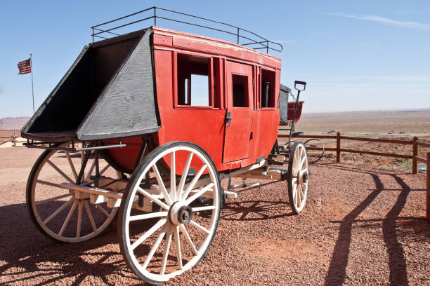 Old West Horse Drawn Stagecoach This horse drawn stagecoach, symbolic of the Old West, is on display at Oljato in Monument Valley, Utah, USA. jeff goulden monument valley stock pictures, royalty-free photos & images