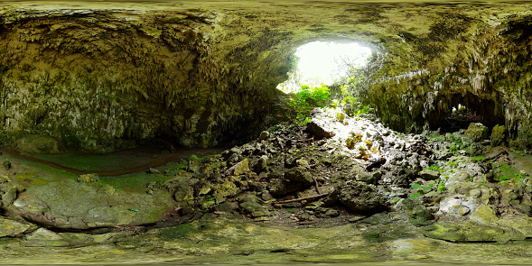 Cave with sunlight through hole on cave ceiling. Bulwang Caves. Mabinay, Negros, Philippines. 360VR.