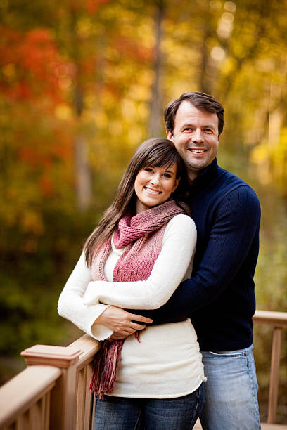 istock Happy Couple Standing Together Outside on Fall Day 171356537