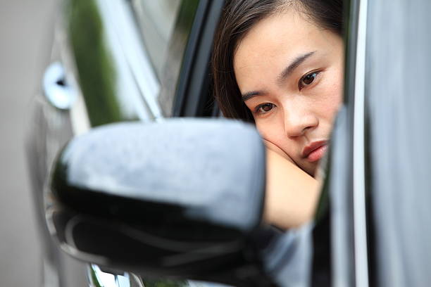 istock Sad woman sitting in a car 171356780
