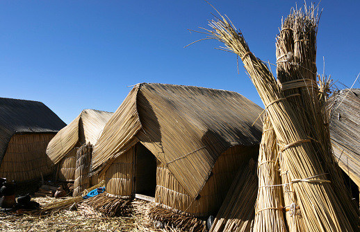 These are some of the small huts woven from reeds where people live on the floating Uros Islands on Lake Titicaca in Peru.