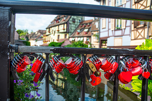 17. 07. 2023 Colmar, Alsace, France,R ed Padlocks in the shape of hearts in the little Venice