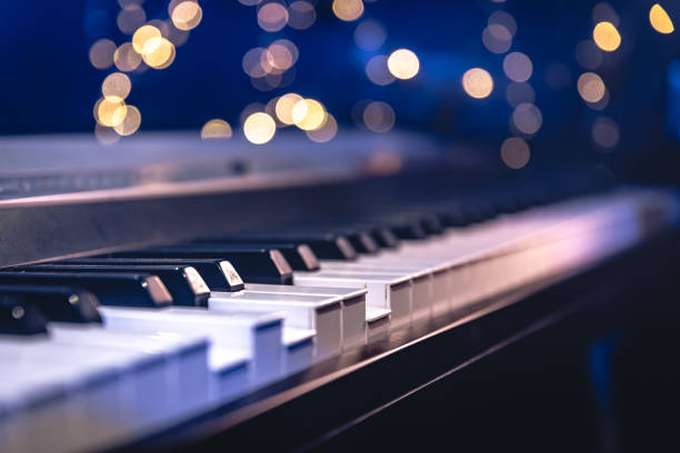 istock Piano keys close-up on a blurred background with bokeh. 1713570185