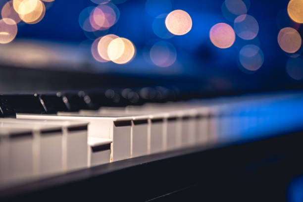 istock Piano keys close-up on a blurred background with bokeh. 1713570190