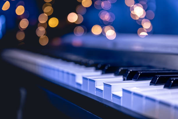 istock Piano keys close-up on a blurred background with bokeh. 1713570192