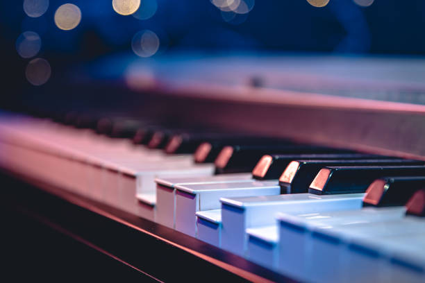 istock Piano keys close-up on a blurred background with bokeh. 1713570196