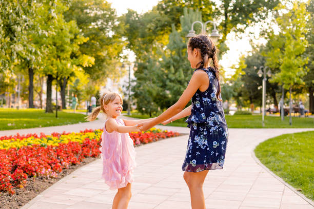 istock Two happy girls playing in the park 1713571407