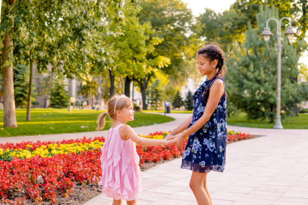 istock Two happy girls playing in the park 1713571992