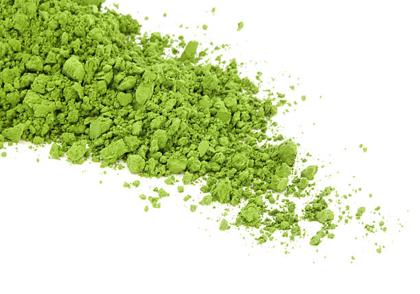 Matcha green tea spilt over the white surface Matcha green tea green tea powder stock pictures, royalty-free photos & images