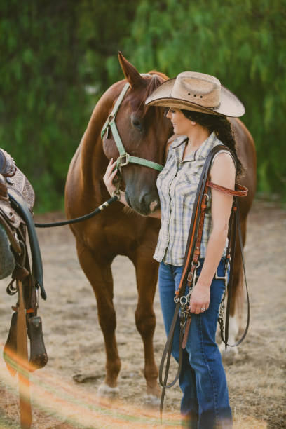 istock Woman With Her Horse on a Ranch 171357569