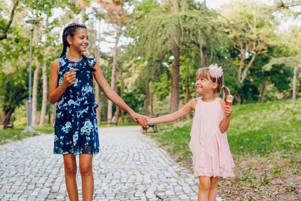 Two little girls having fun and running together