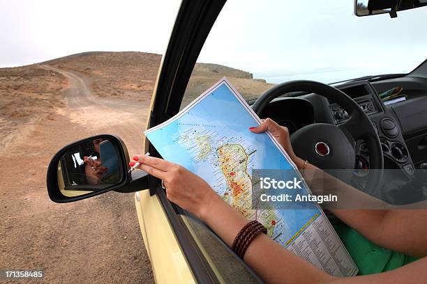 Women Reading Map Stock Photo - Download Image Now - Lanzarote, Road Map, Road Trip