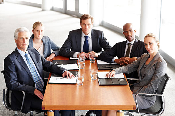 istock Business Team Posing at a Conference Table 171358884