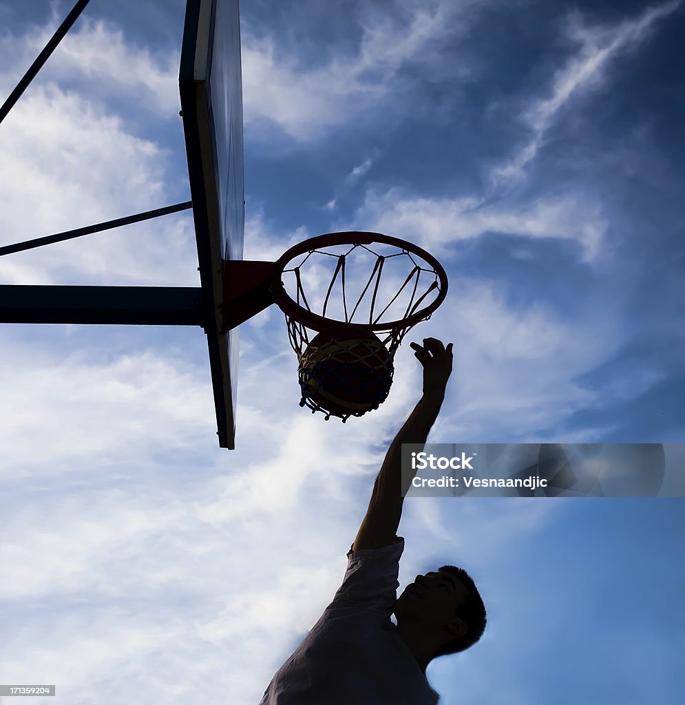 Young man playing basketball 25-29 Years Stock Photo