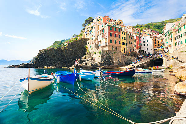 A view from the water of Riomaggiore, Cinque Terre Riomaggiore, Cinque Terre (Liguria, Italy). fishing village photos stock pictures, royalty-free photos & images