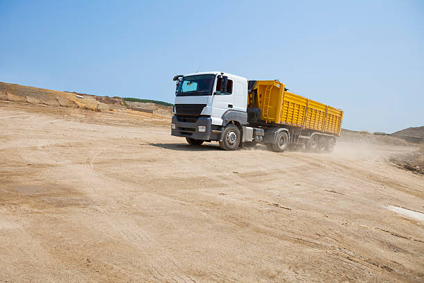 istock dump truck speeding at sand mine 171359225