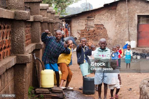 Boys Collecting Water In African Slum Stock Photo - Download Image Now - UNICEF, Africa, Politics