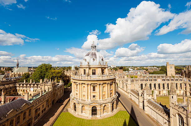 Radcliffe Camera and All Souls College in Oxford "The Radcliffe Camera and All Souls College (right) in Oxford, England" oxford university photos stock pictures, royalty-free photos & images